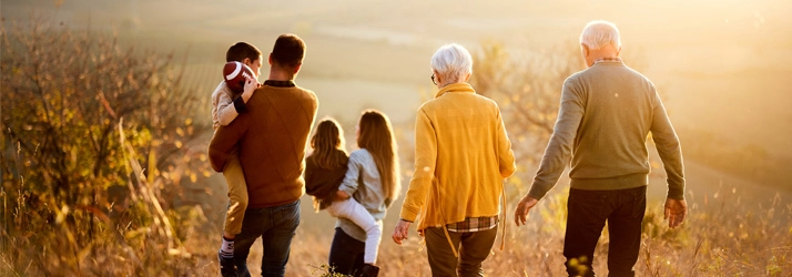 Chiropractic Bellevue WA Family Hike A family walking in a field.