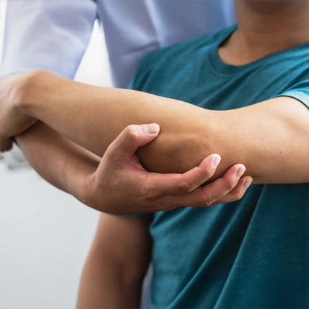 A patient receiving rehabilitation services to their arm.