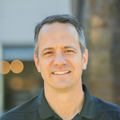 A headshot photo of Dr. Mark Thompson, a chiropractor at Dynamic Chiros - Bellevue